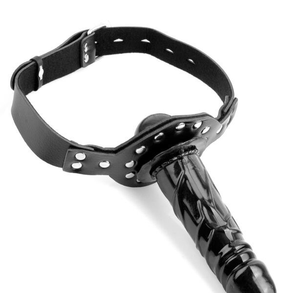 Make a statement without saying a word with this Deluxe Ball Gag with Dildo. <br><br> This 2-in-1 gag has something for both of you: a smooth