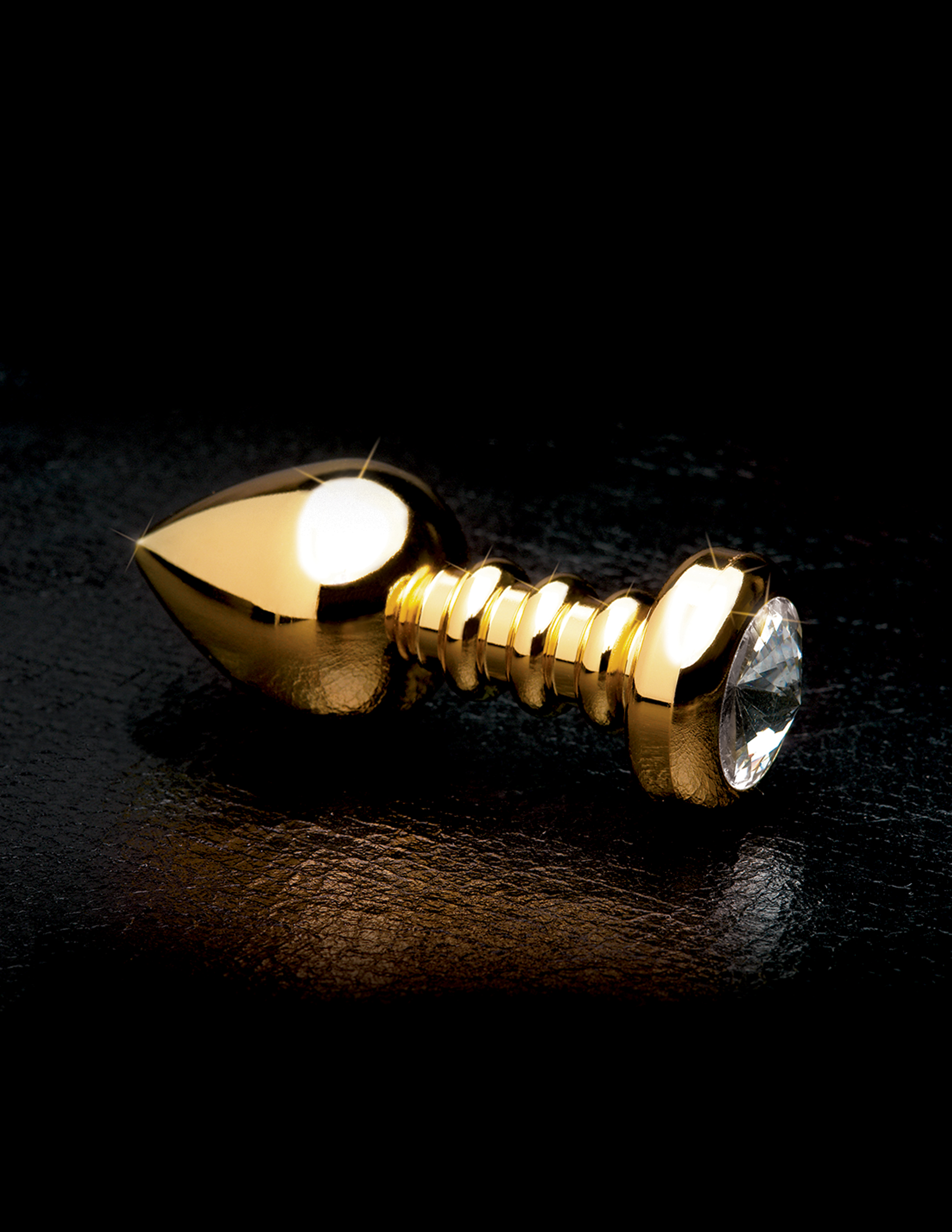 Enjoy incredible back door bliss with this elegant ribbed Luv Plug. The sleek plug is made of Pure Aluminium and is incredibly smooth nonporous and body-safe. The tapered tip eases insertion while the neck is perfectly ribbed for enhanced pleasure. The super hygienic Pure Aluminium is great for water-based temperature play and is small enough to take with you wherever you go. The wide crystal-adorned base ensures safe and easy removal but while its inserted the only thing your lover will see is the beautiful sparkling crystal.