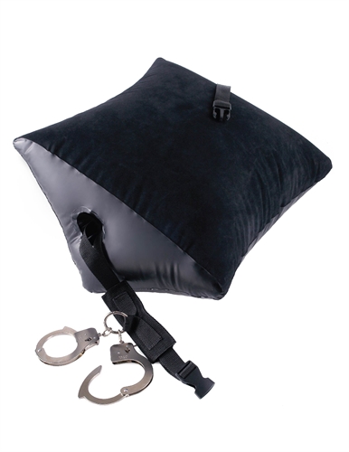 which then connects to a pair of heavy-duty metal cuffs. Once your subject is bent over the wedge-shaped pillow and strapped in