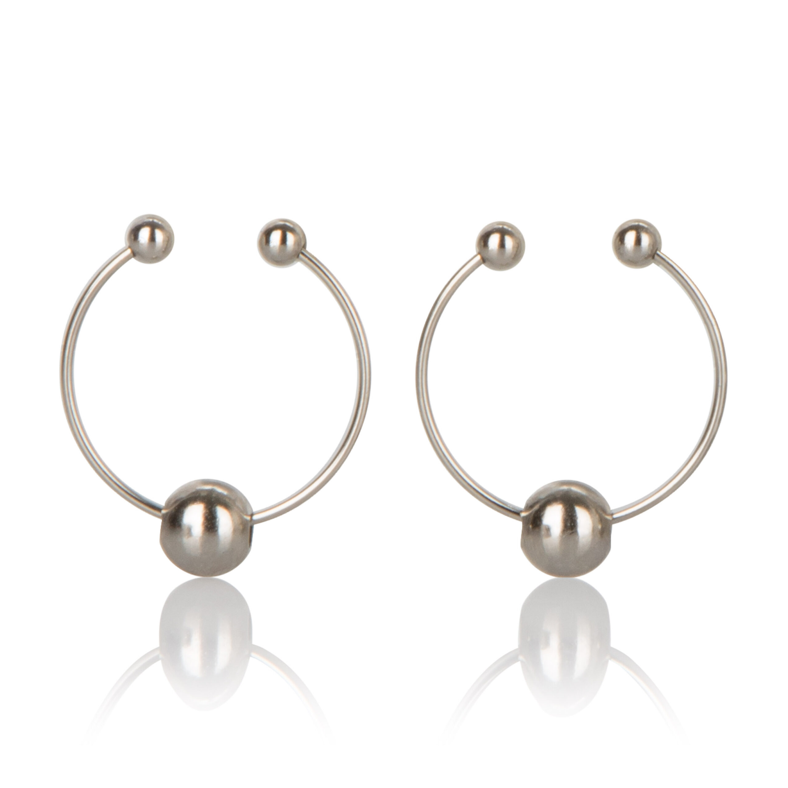 and measure a compact 1 2" (3cm) in diameter. The hoop style is embellished with sensuous beads that dangle provocatively and stimulate the senses. Designed to comfortably attach to the nipple without the need to commit to body piercing